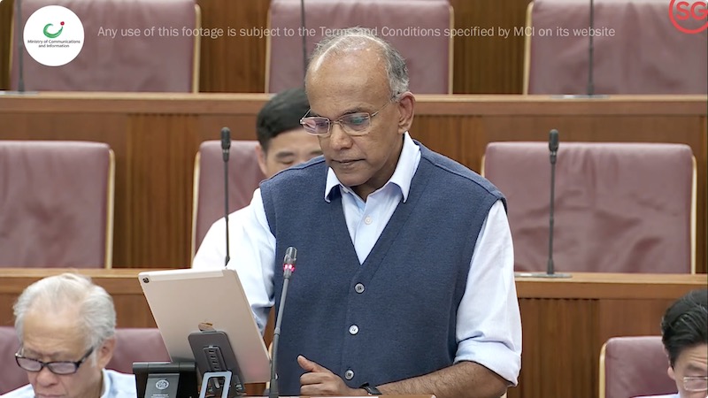 K Shanmugam giving a speech